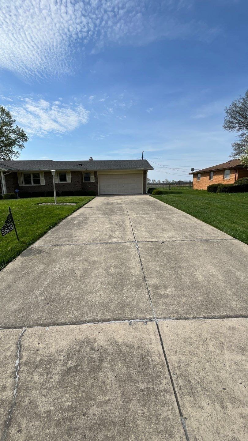 Long cleaned concrete driveway at an Anderson ranch home