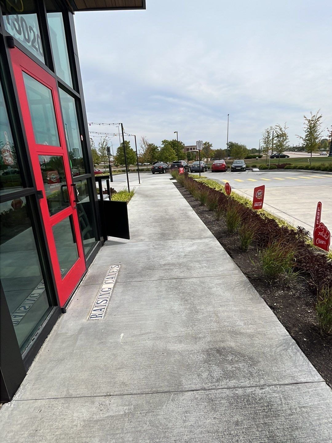 Cleaned concrete walkway running along a Noblesville storefront